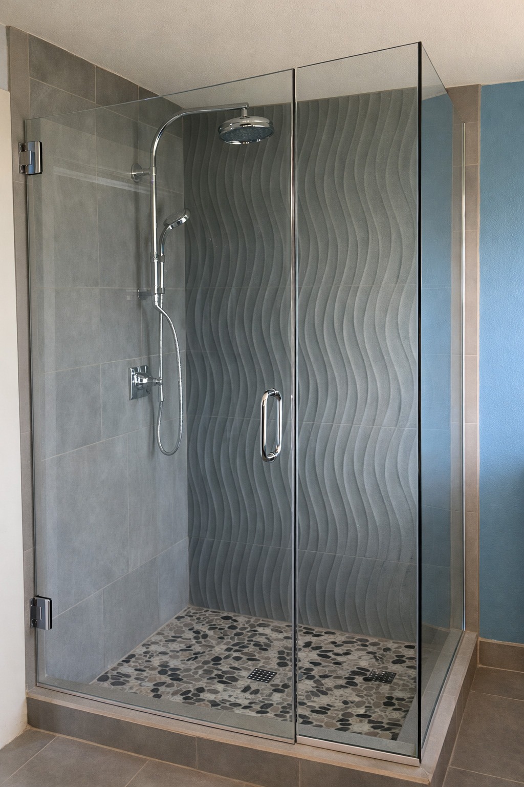 corner shower with wavy tile