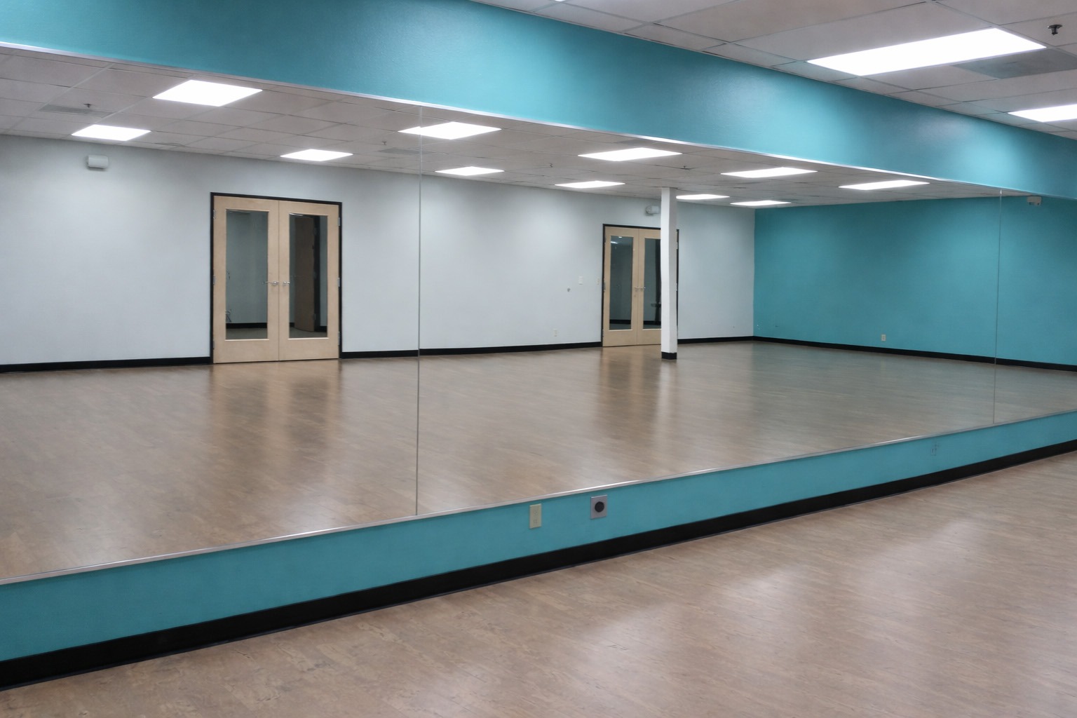 mirror wall with blue walls